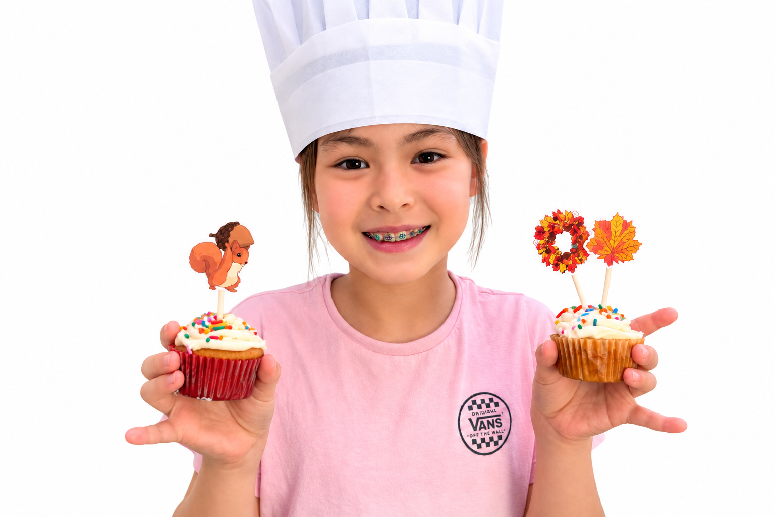 Smiling Baker with Decorated Cupcakes.png