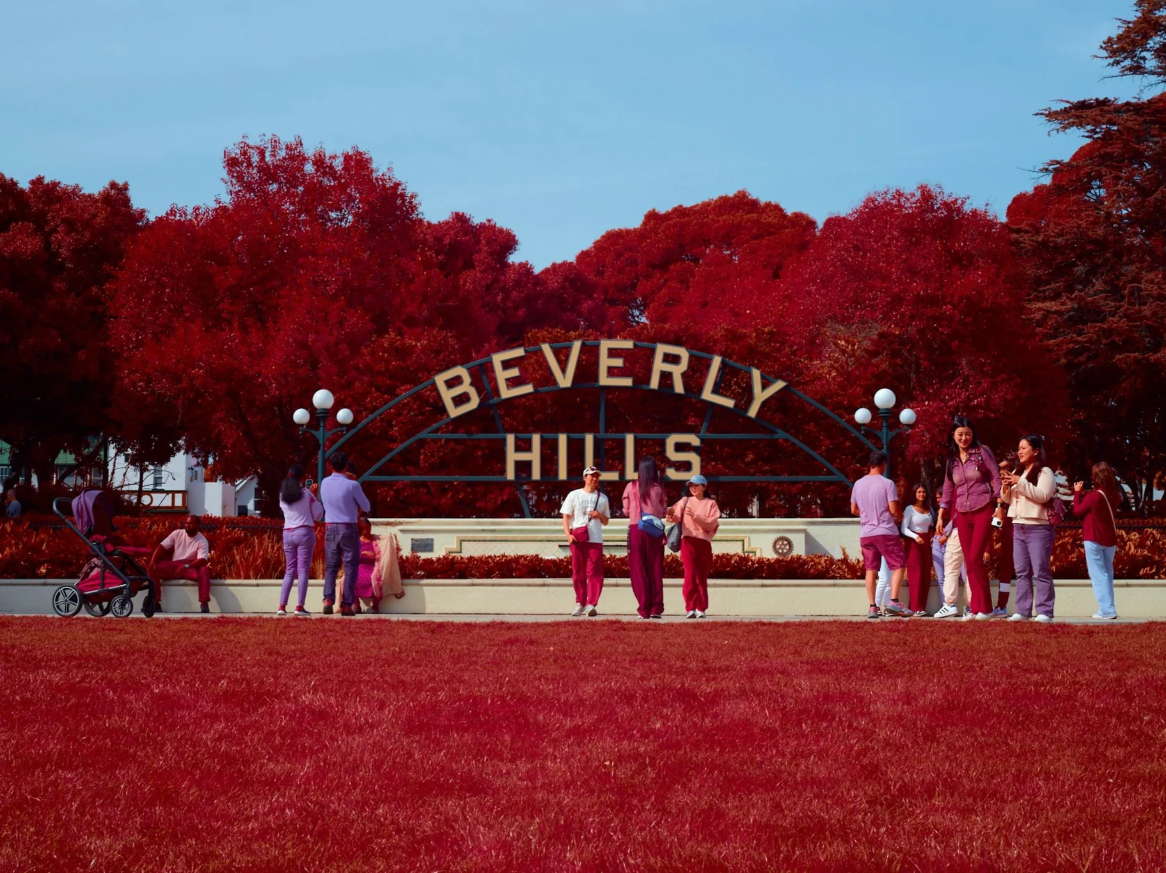 beverly hills sign with tourists taking pictures. The image is a mix between infrared light show by blocking the green light using a blue filter and full spectrum digital sensor. 