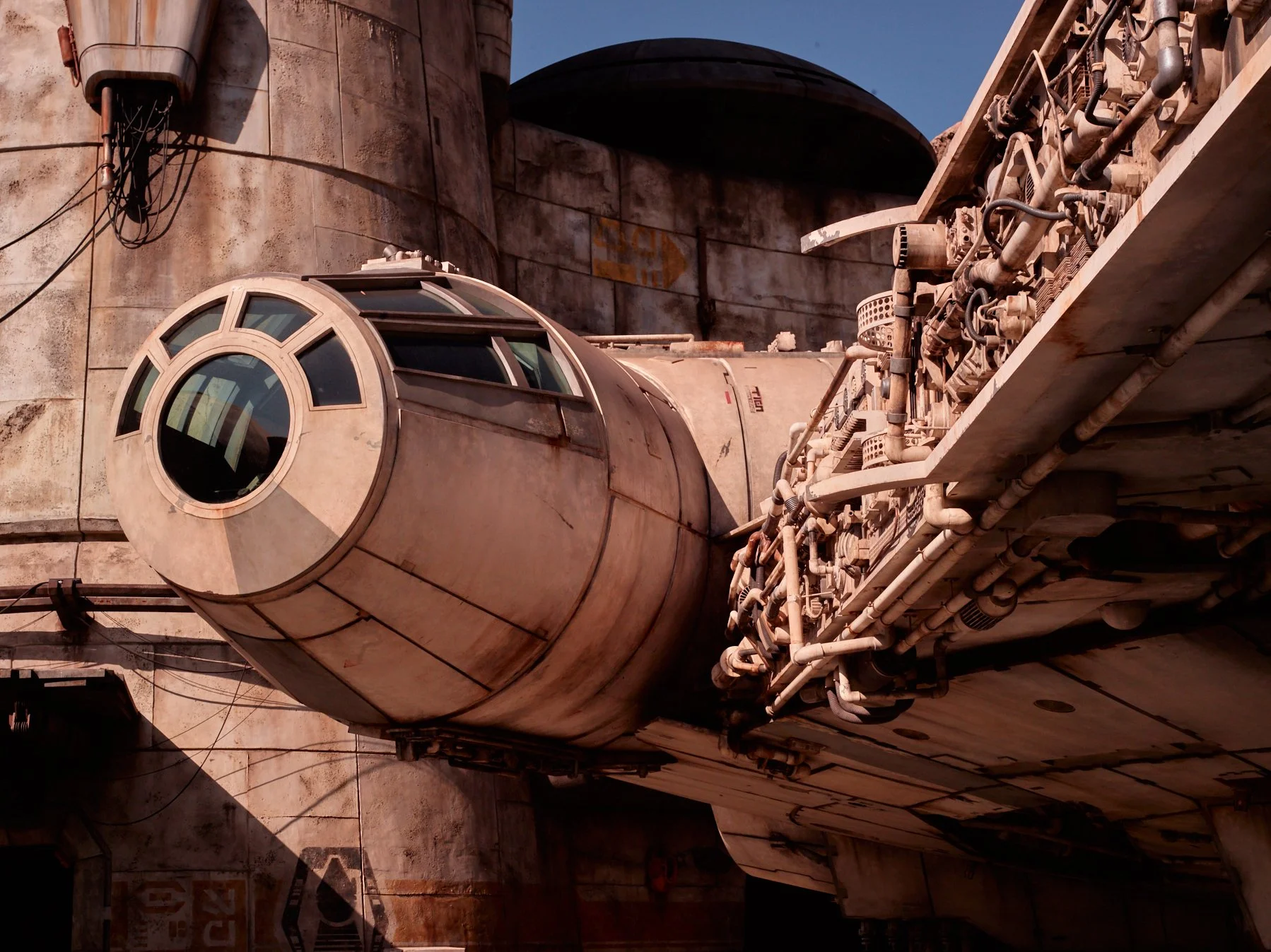 The cockpit of the millenium falcon docked outdoors at galaxies edge