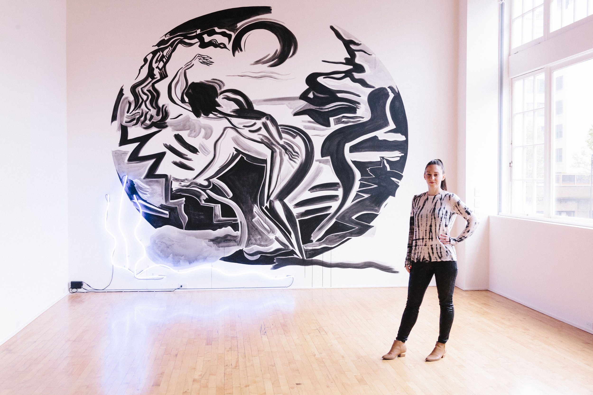 Mira Dancy with her mural at the Lumber Room, Portland OR