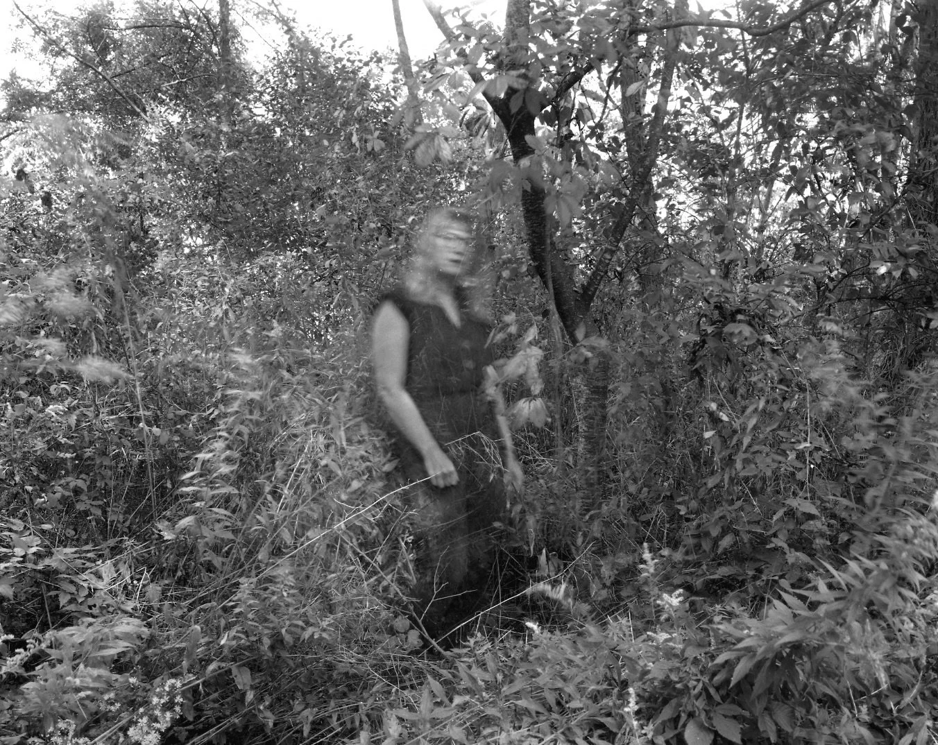 A self portrait of me dissolving into the trees for earth day 🖤 

&ldquo;The trees threaded a cat&rsquo;s cradle of half-stripped branches over me so that I felt I was in a house of nets and though the cold wind that always heralds your presence, ha