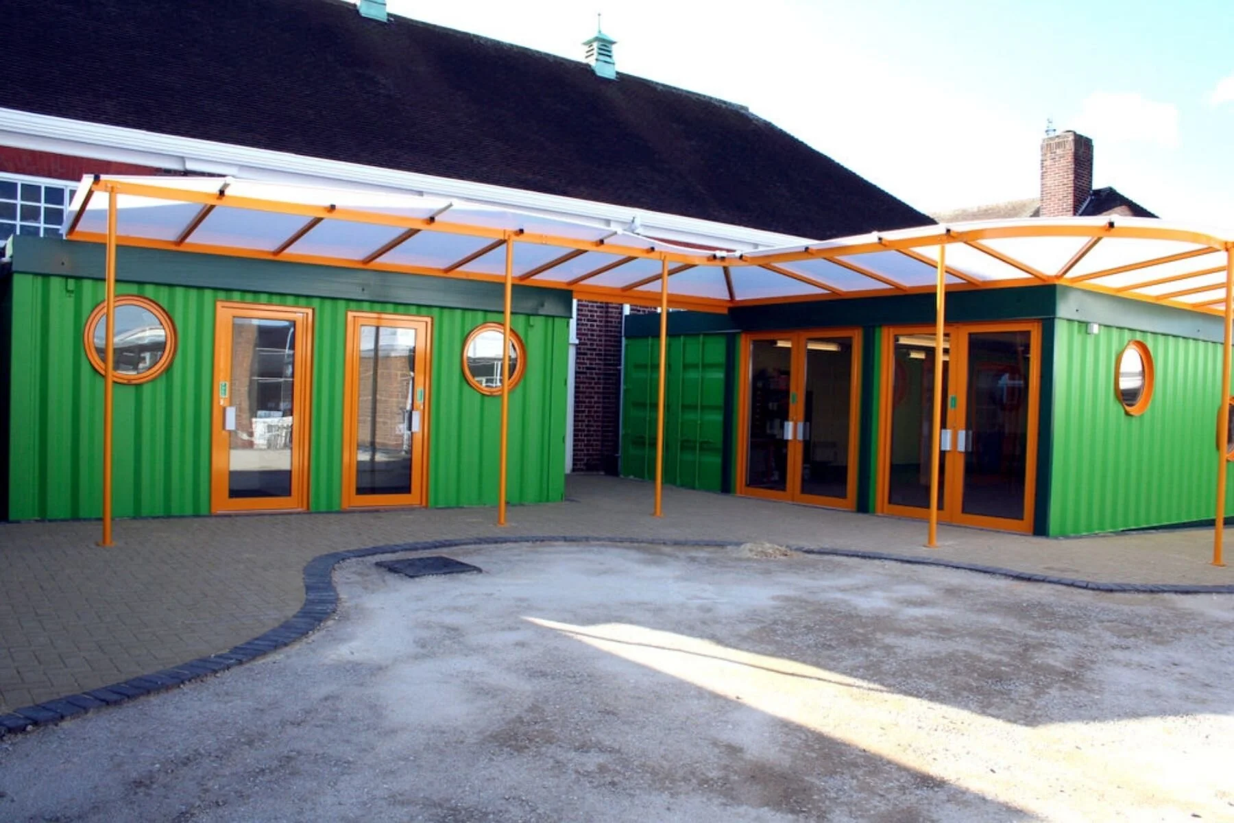 Cuffley School green and orange container classrooms by Container City