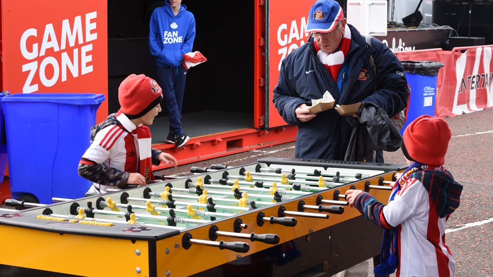 Two young fans go head to head at table football.jpg