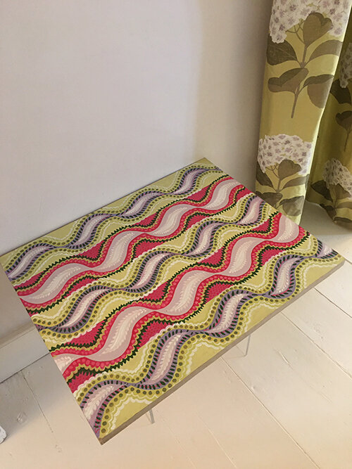A new table top to compliment the existing room colour scheme. The table top was hand painted and attached to an existing undersized perspex table.