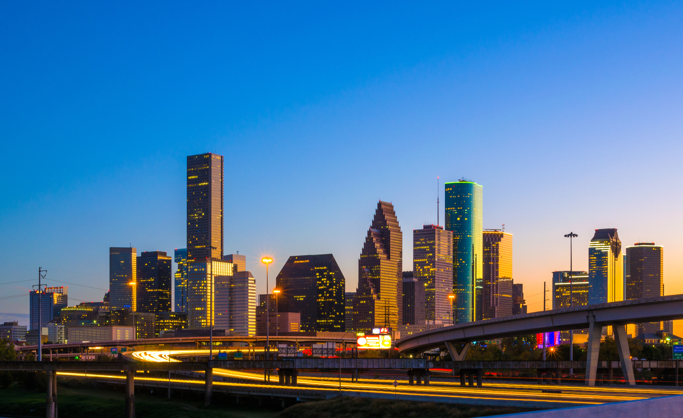 Downtown-Houston-Skyline-at-Sunset-with-Orange-Reflection-584754238_2215x1358.jpeg