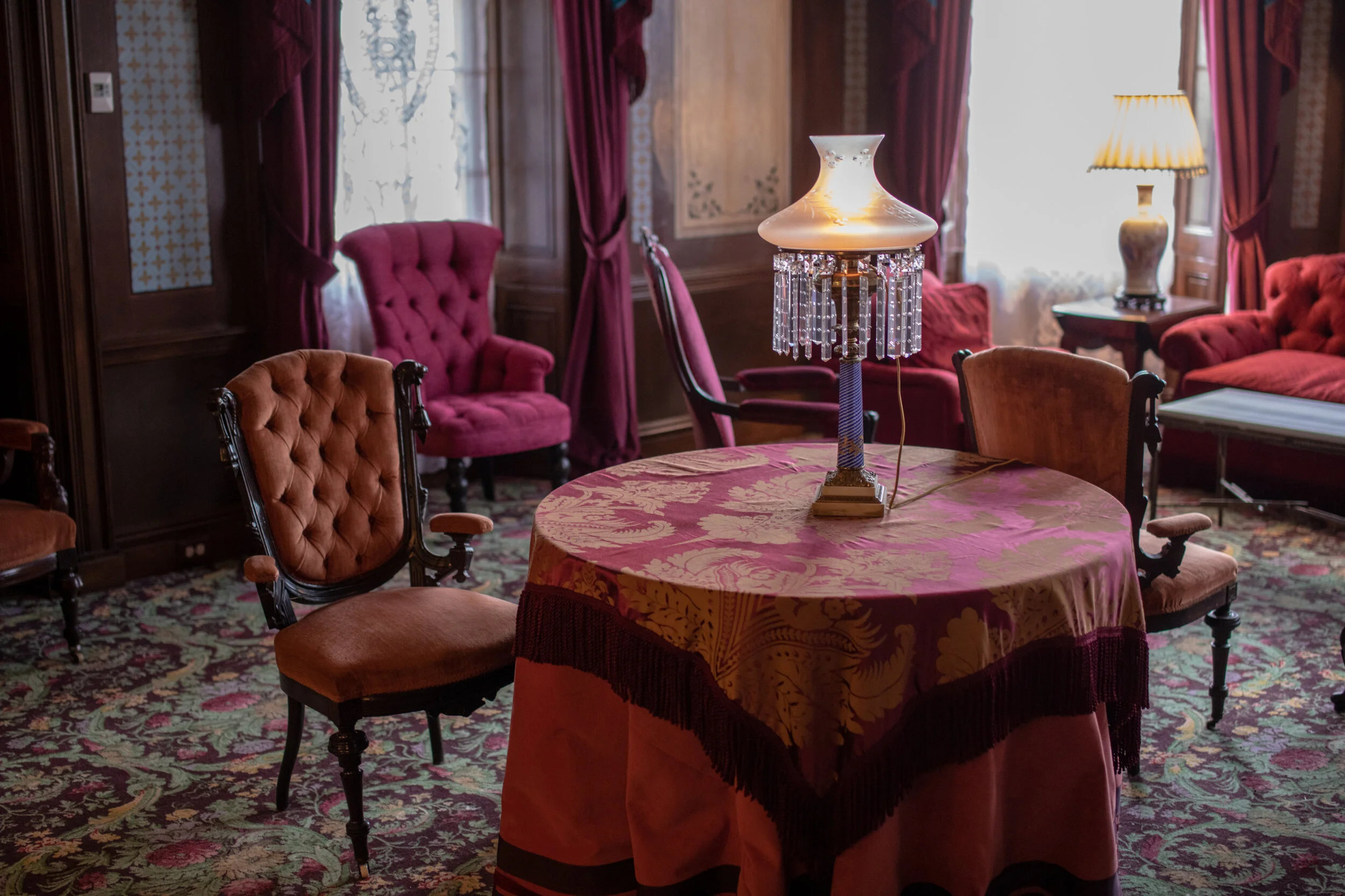  This beautifully proportioned room with numerous windows was added to Henry Thompson's country house around 1810. Much of the woodwork and the restored cornice are from the original construction. Neirnsee and Neilson, the architects who enlarged Cli