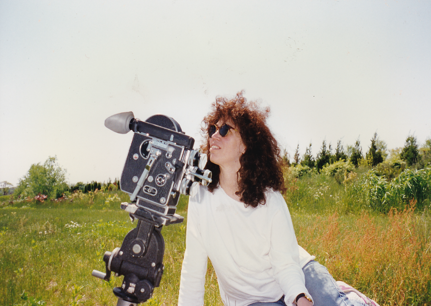 Jane Aaron posing with her Bolex