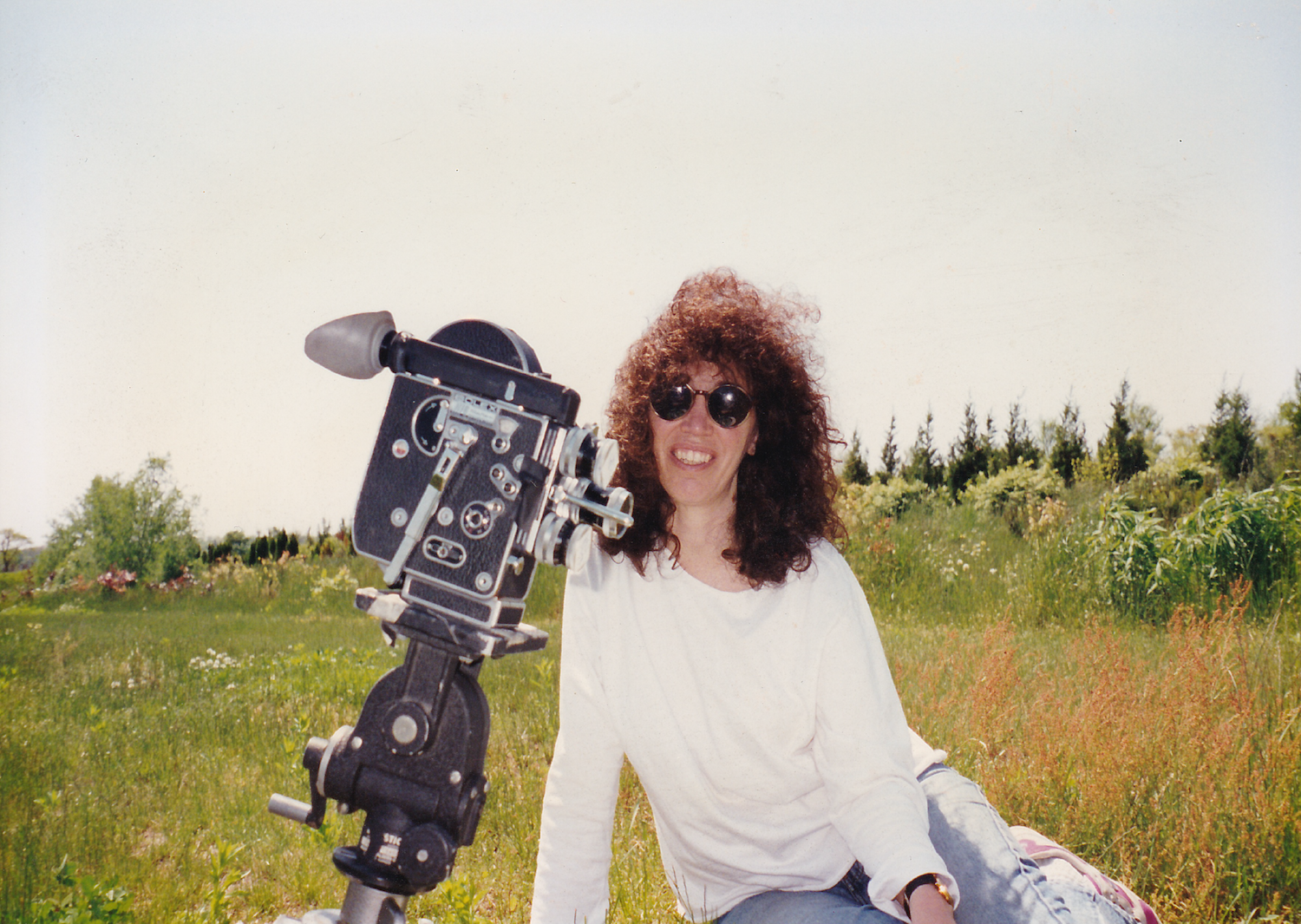 Jane Aaron posing with her Bolex