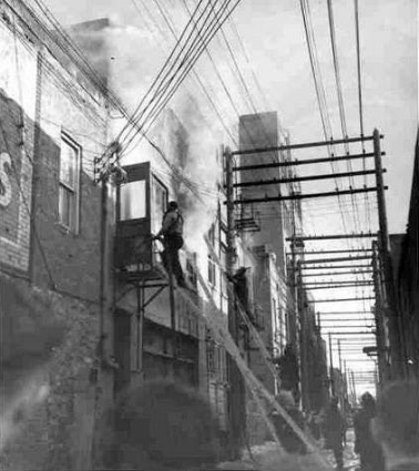 In 1955, one of the apartments behind the shop went up in flames.