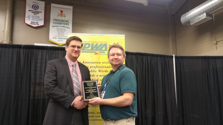Josh Mickelborough being given the Professional Manager of the Year Award by Dale Petrun, an SPWA board member