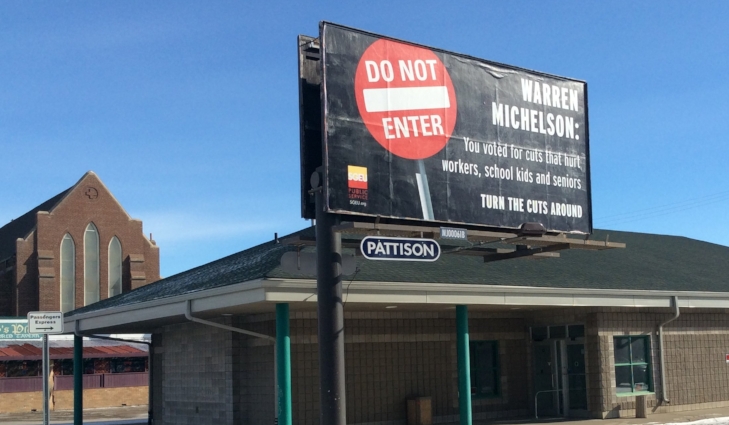 Billboard, in front of the Greyhound Station, on High St.