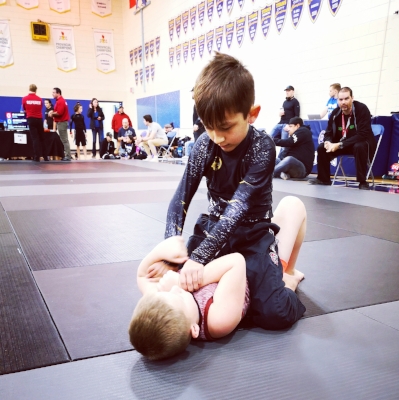 Jacob Gaspar searching for an arm bar to finish off his opponent.