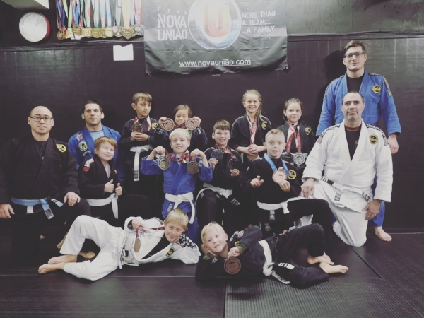 The team, posing in the bunker on the morning after the tournament. Coaches: Donald Booth (Black Gi), Jason Church (Blue Gi on left), Shane Kivol (Blue Gi on right), Chad Beliveau (White Gi on Right)