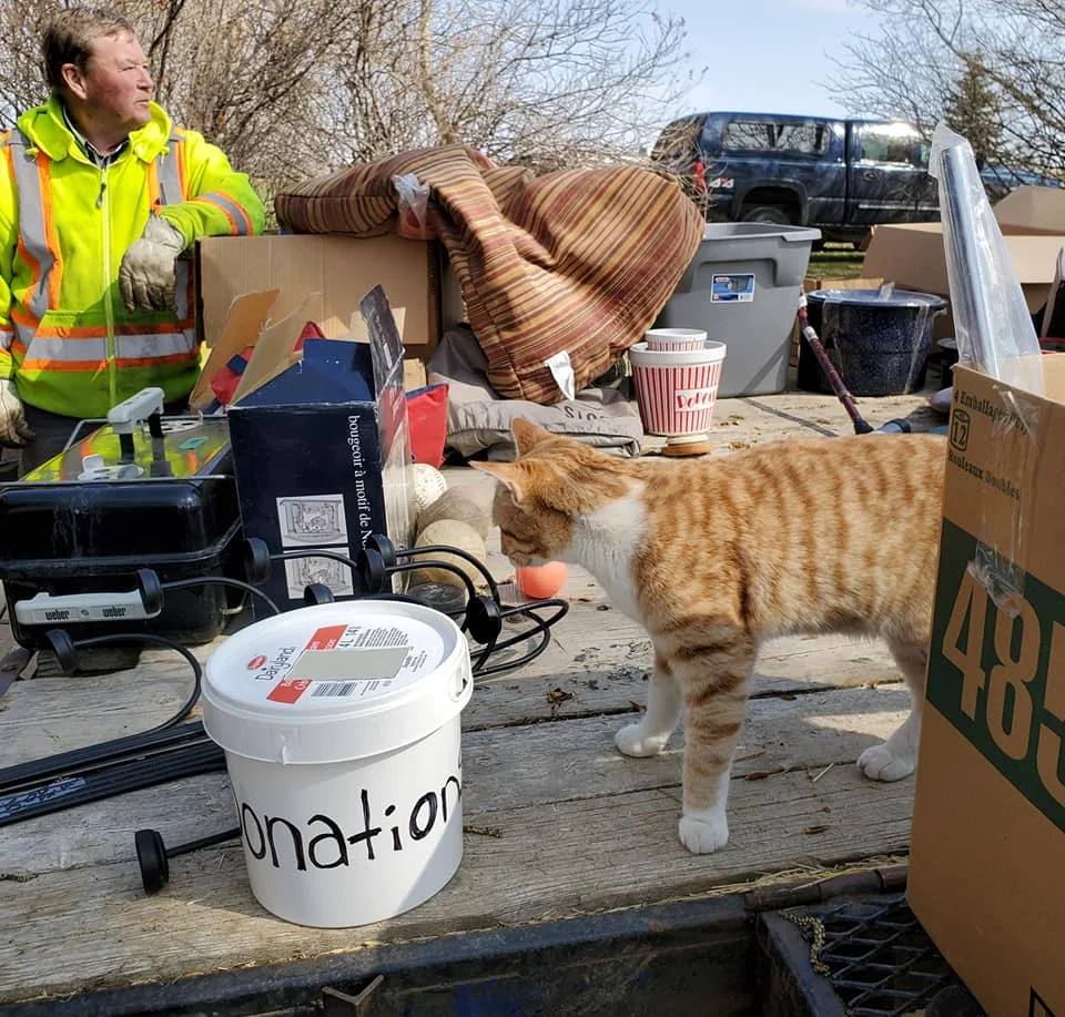"I see donations, but come on, let's fill this pail!" (Photo by K. Epp)