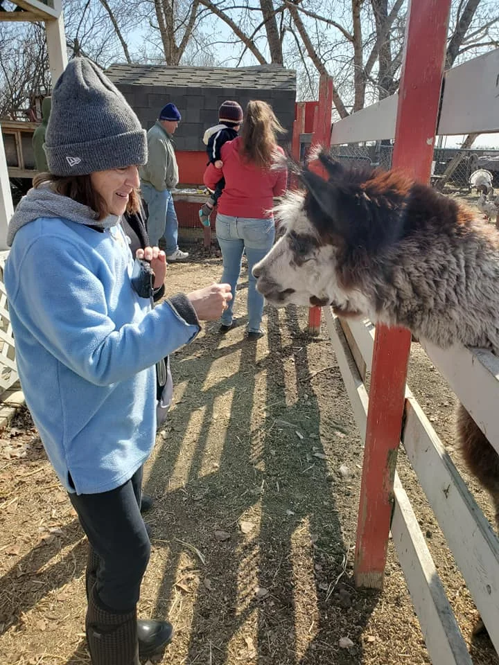 A lady from Regina traveled to our friendly city for the sale, and to get her farm animal fix. ❤ (Photo by K. Epp)