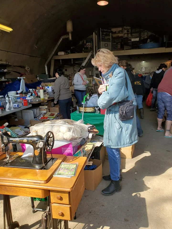 The quonset was full, already partly emptied out by this time. Thanks to all the donators. (Photo by K. Epp)