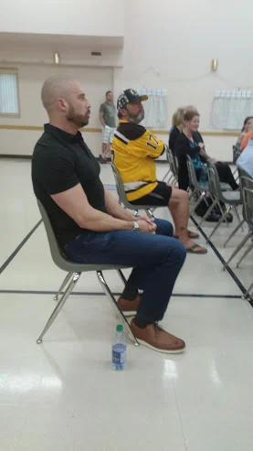 Jeremy Brehm gave a prepared emotional speech then moved to the back of the auditorium