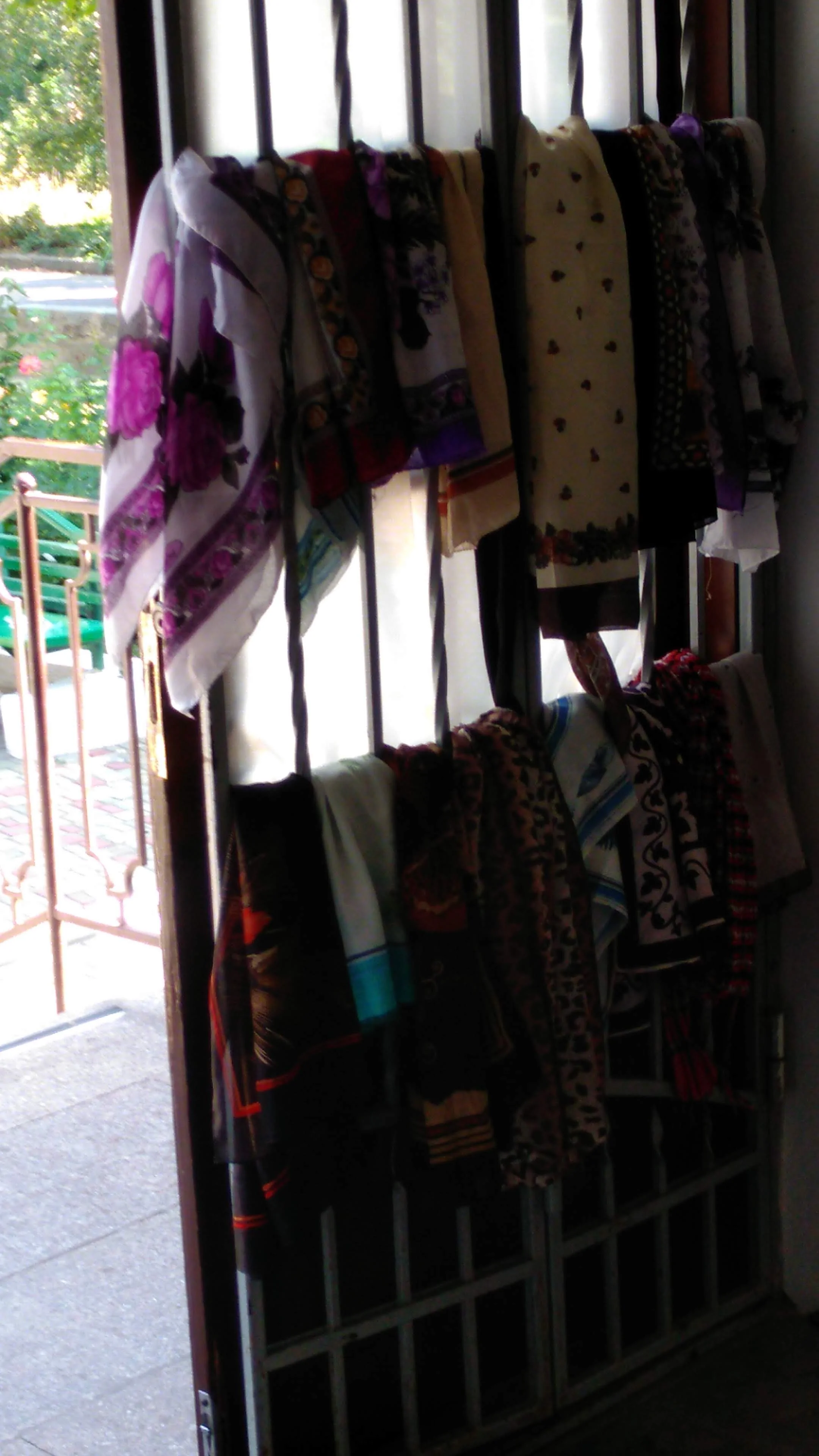 Scarves hang at the entry way which may be worried
