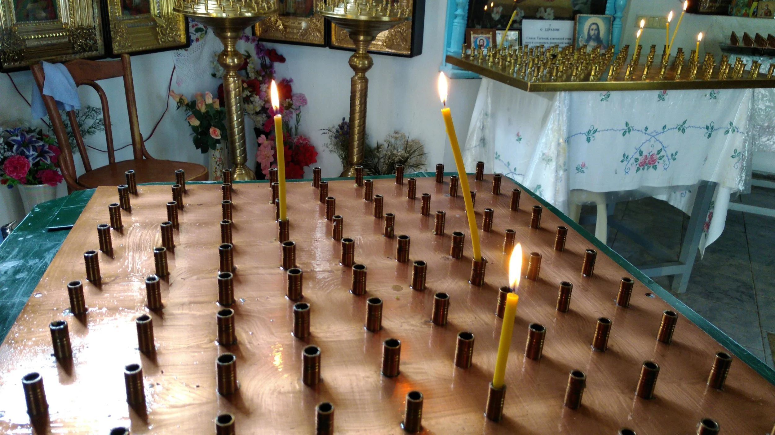 Candles burn in the prayer chapel