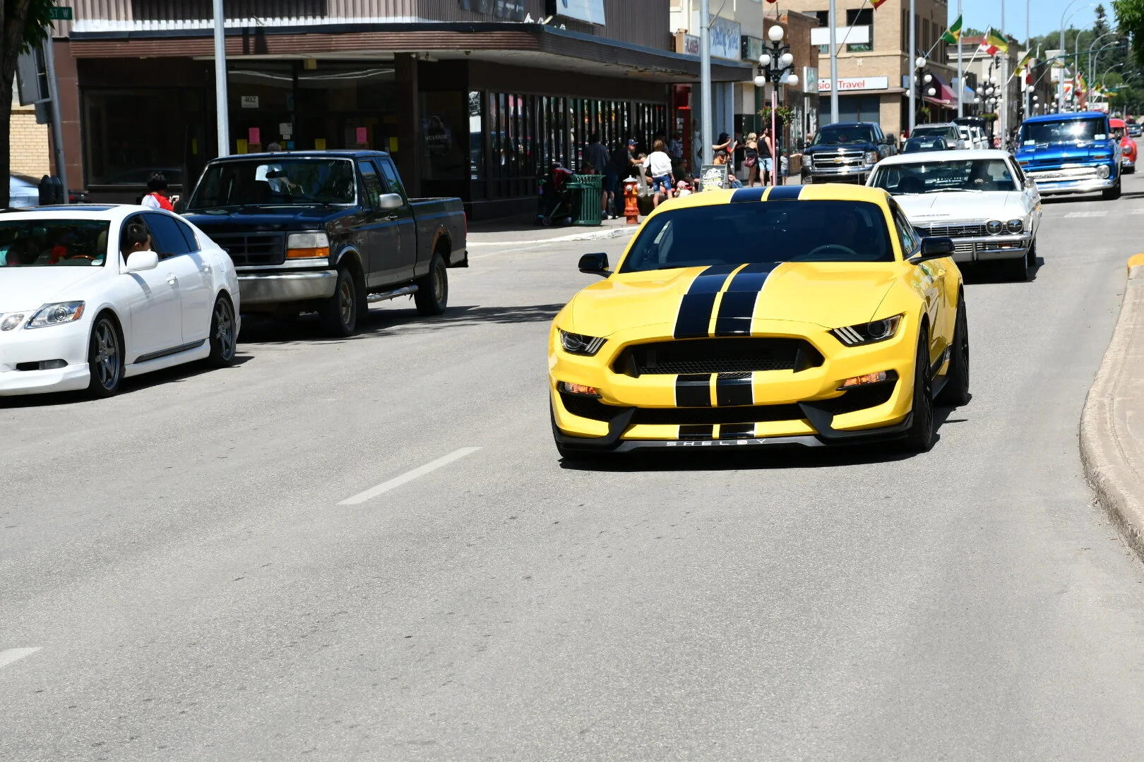 Rolling Car Show Draws Large Crowd Of Onlookers