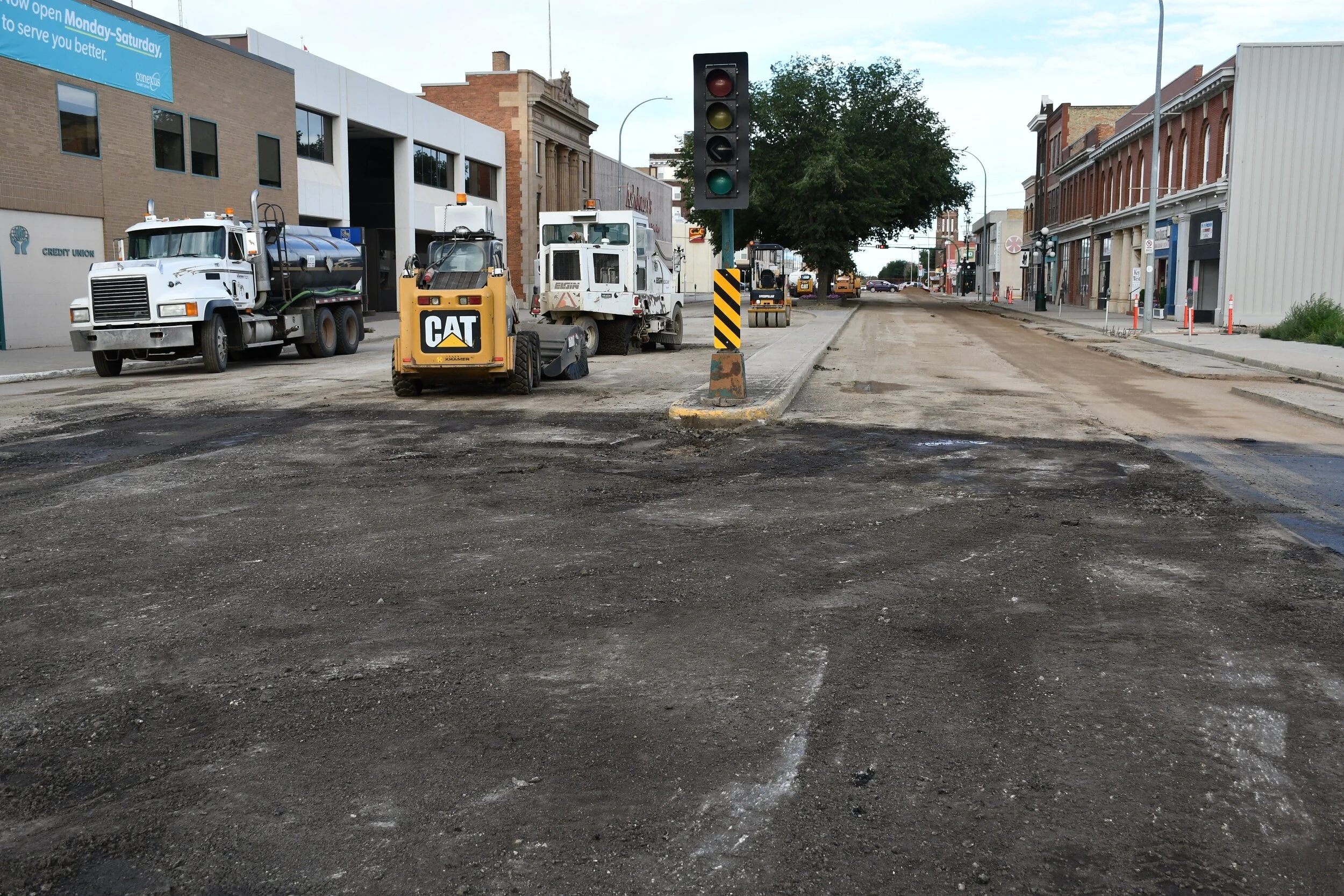 The 0 Block of High Street West now has the paving equipment stationed on jt - MJ Independent photo