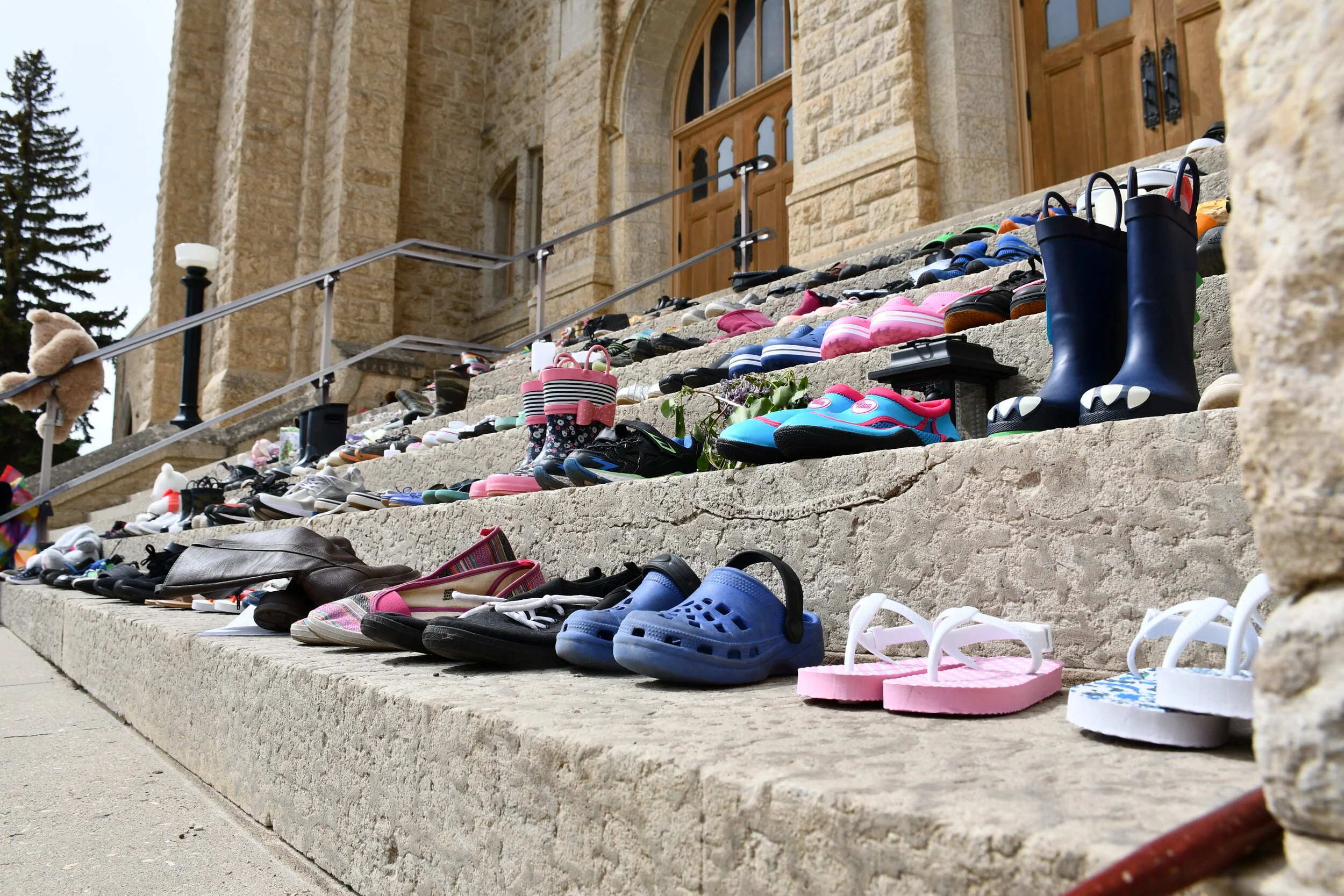 Church's Steps Filling With Children's Shoes In Remembrance Of 215 Children Buried Without Recognition