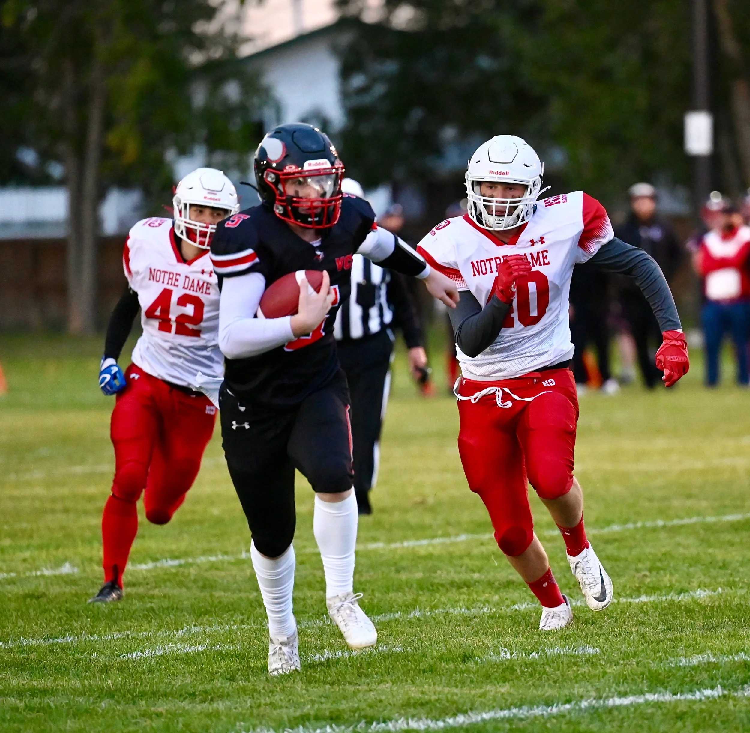Vanier Powers By Notre Dame On A Chilly Wet Evening