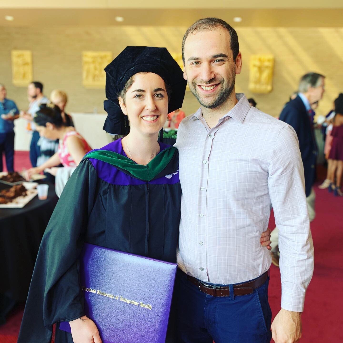 Rena with her husband Roberto at her graduation from Maryland University of Integrative Health