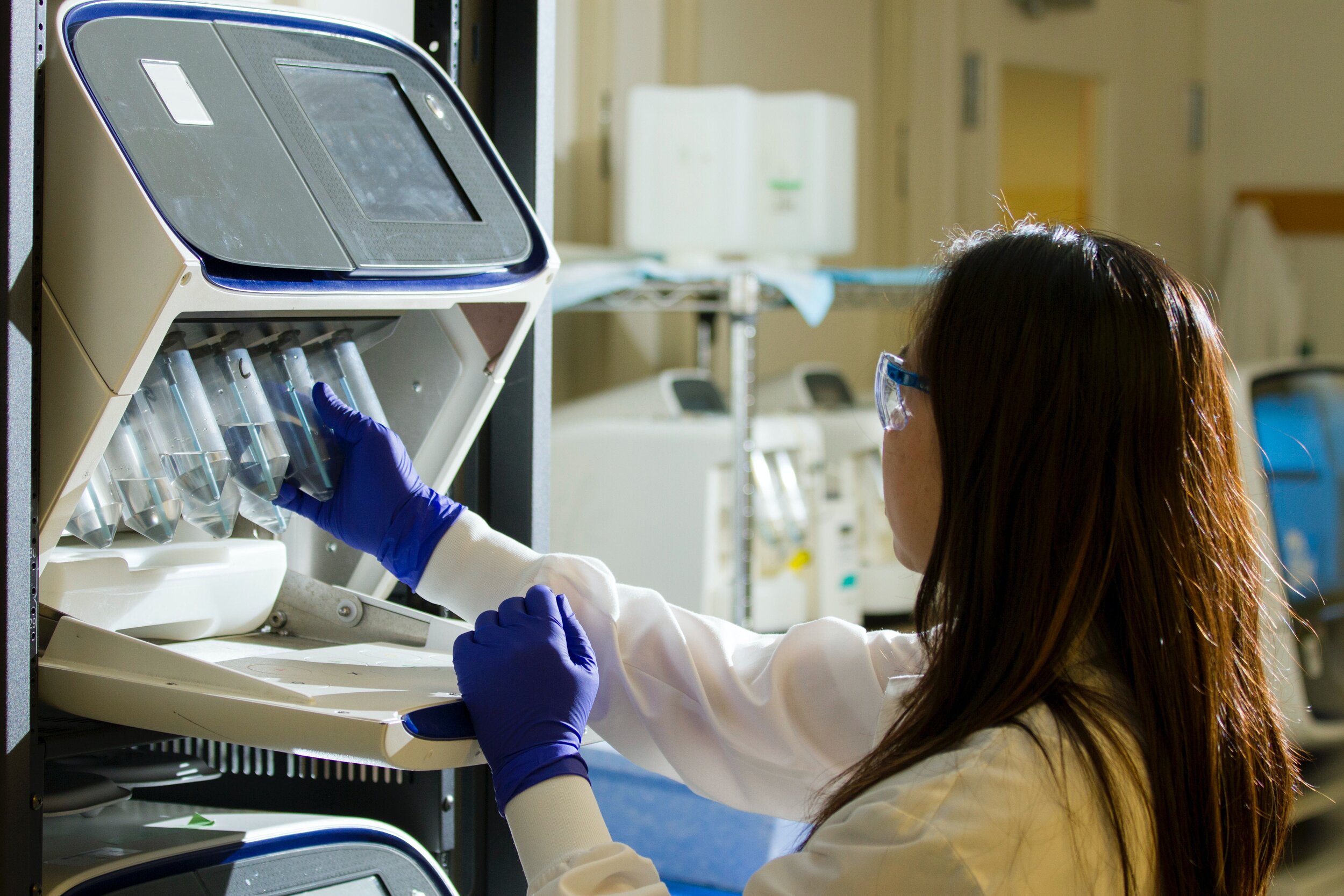 Photo of a researcher using laboratory equipment by National Cancer Institute on Unsplash