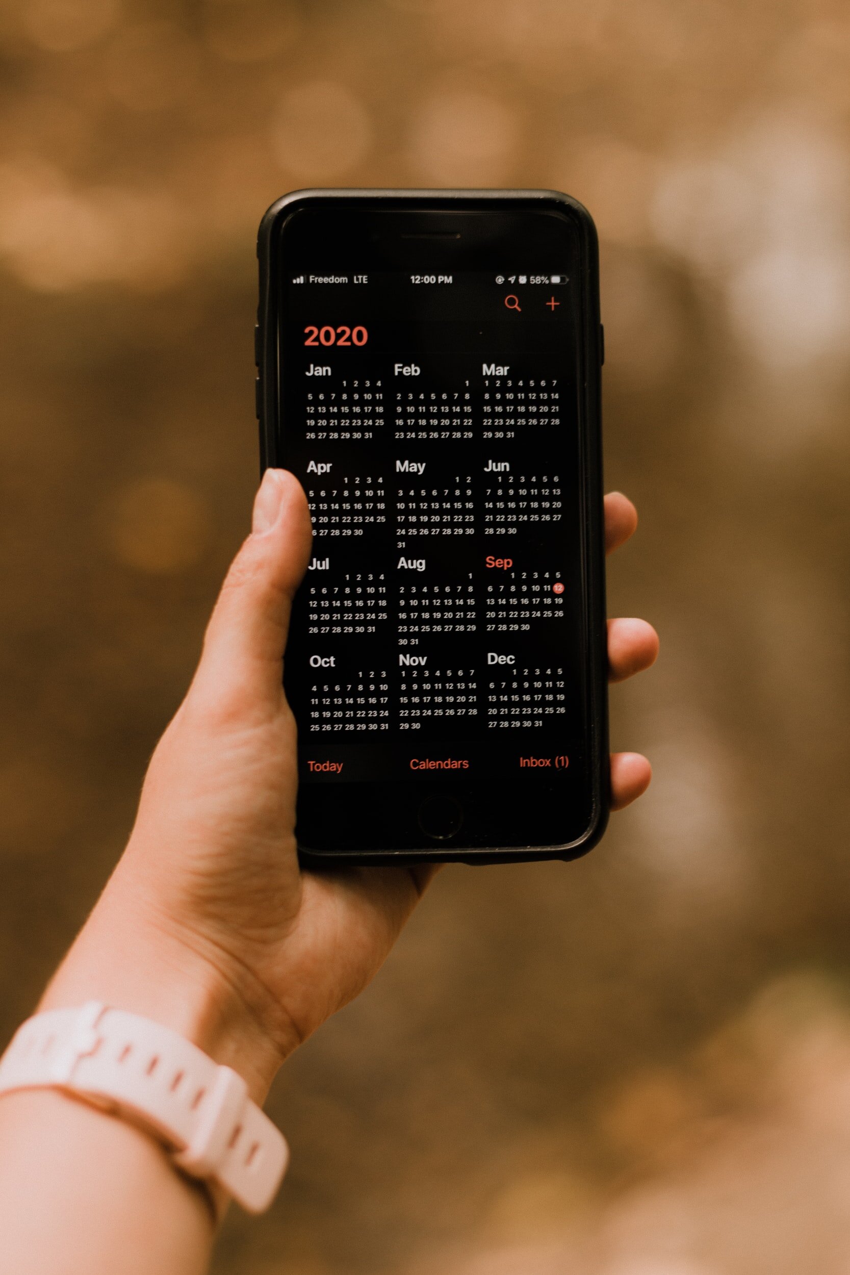Photo by Priscilla Du Preez on Unsplash A person checks their iPhone calendar to keep track of their fuller packed schedule.
