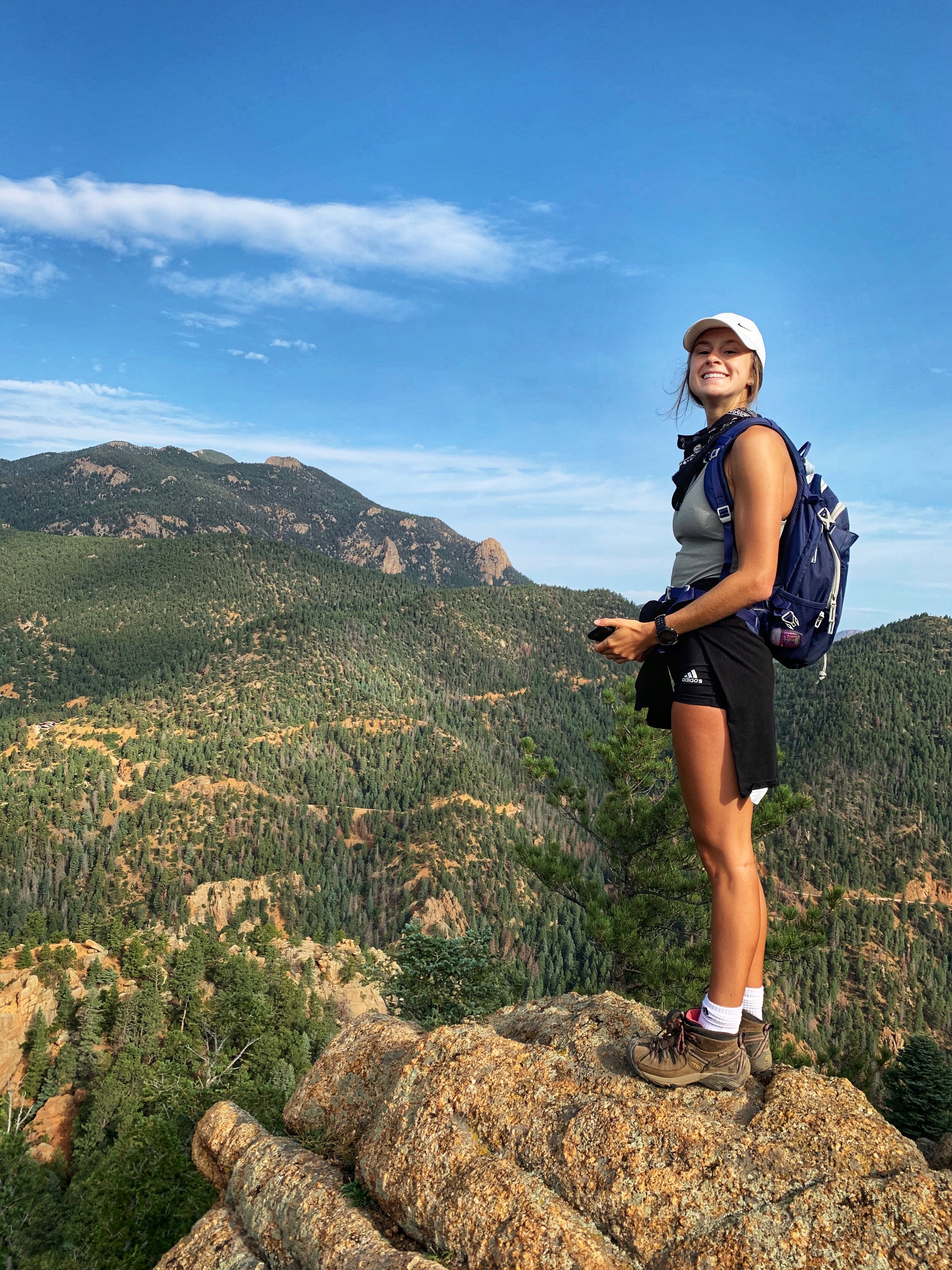 An image of the blog author at the summit of a hike.