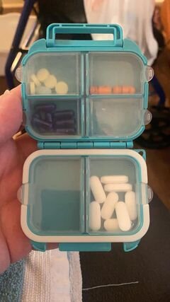 Photo credit: GWG Andrea AcostaPhoto of a blue portable pill container with six compartments for pills.
