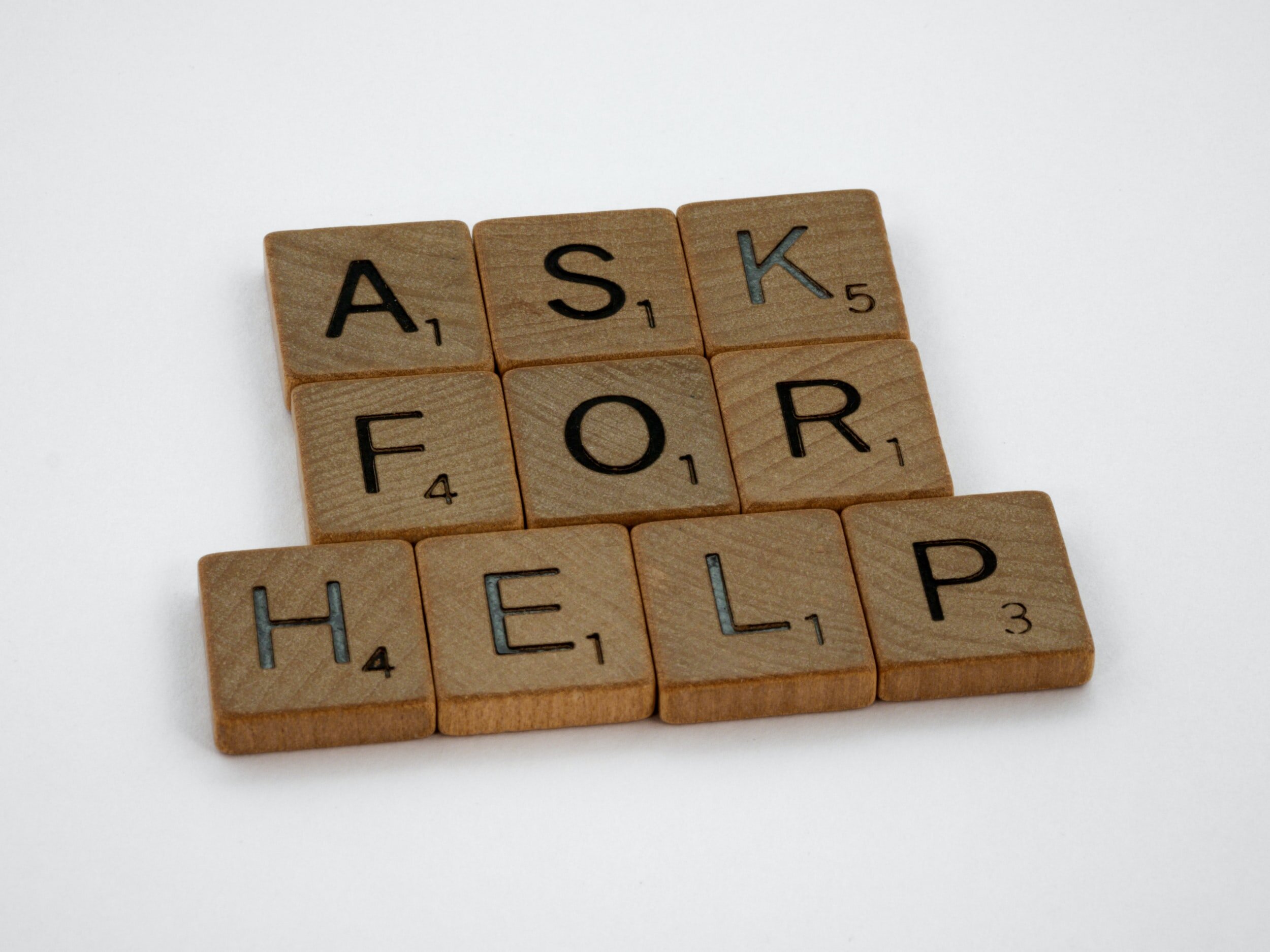 Photo by Brett Jordan on UnsplashWooden scrabble tiles say “ask for help.”