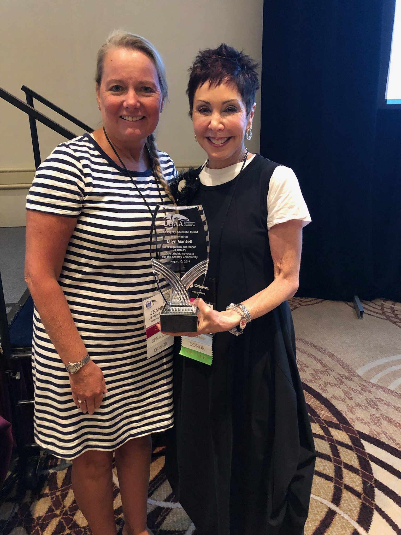 Jean Gleba (the Advocacy Manager of the United Ostomy Association of America) presents Ellyn with the Mighty Advocate of the Year Award in 2019.