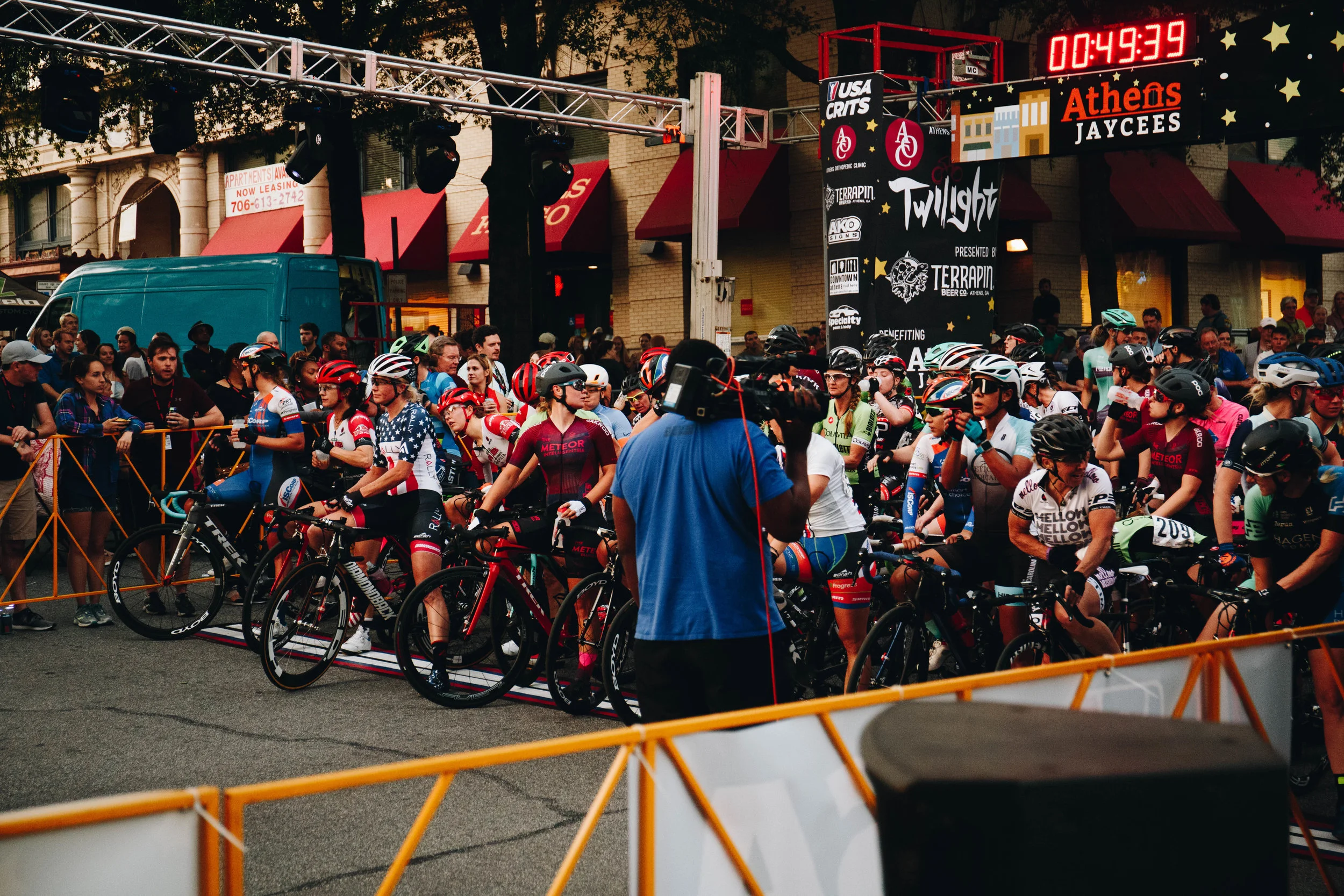 The women's pro-field readies for action in the golden hour before the men's race. 