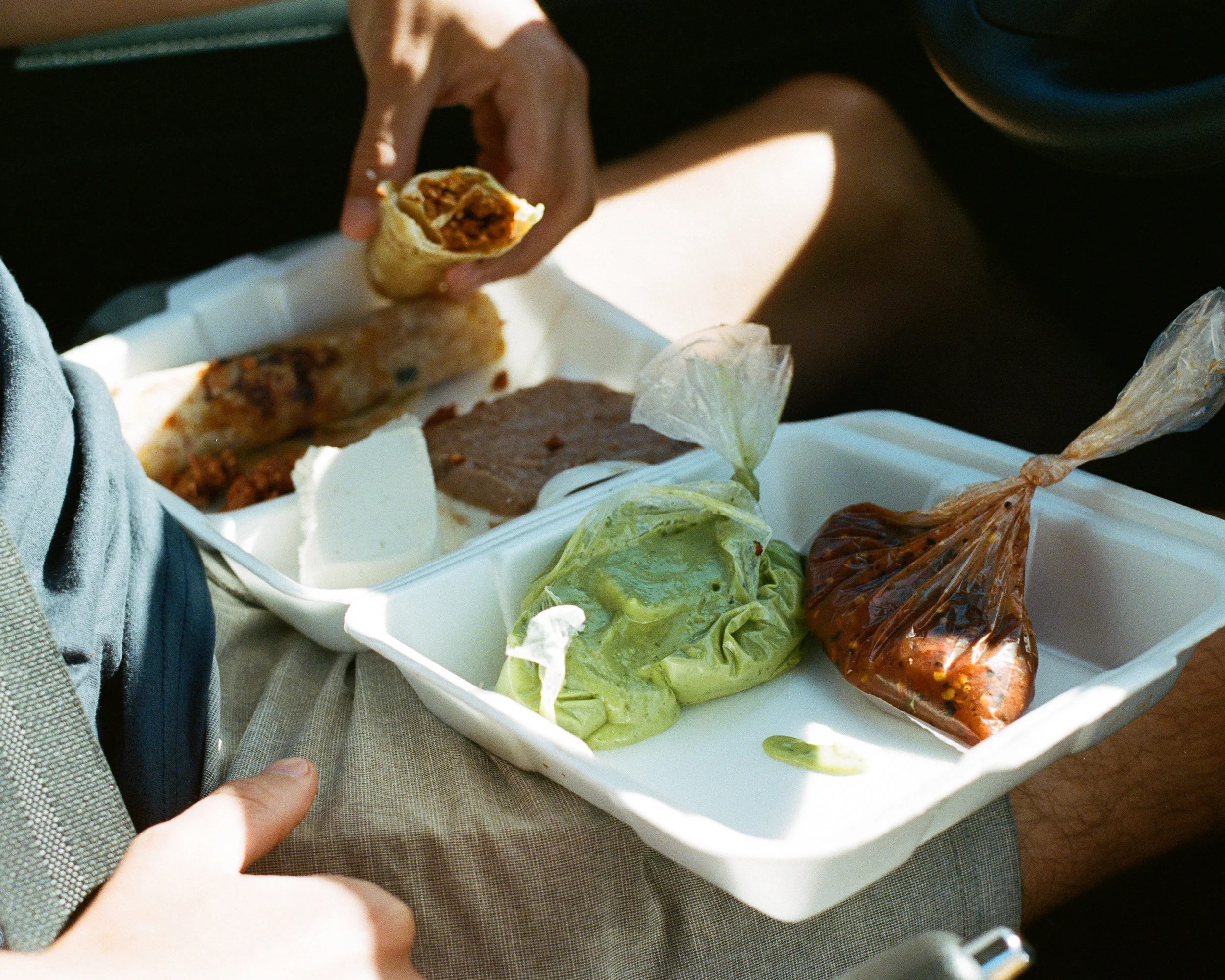Photograph of Nick Messina eating street tacos in Baja Mexico by photographer Jon Moore, Creative Director at The Beans and Rice