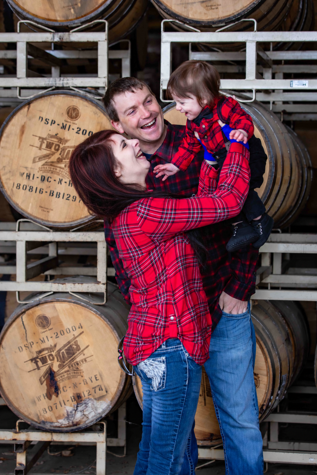 Joyful Family Moment in a Rustic Barrel Cellar.png