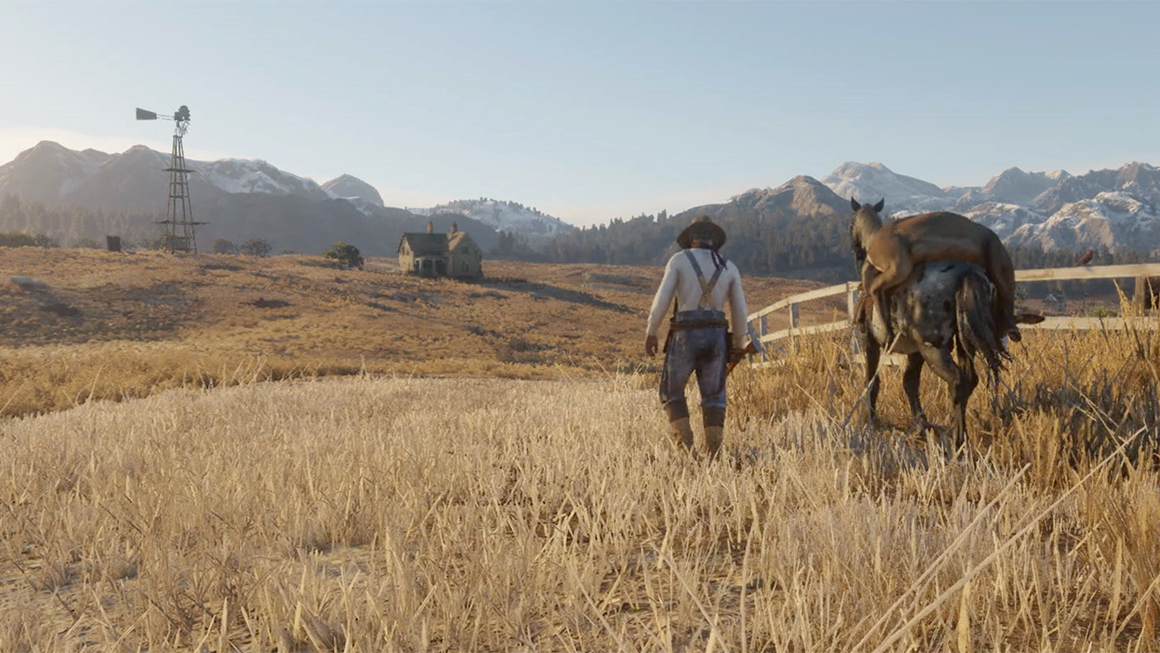  De gyldne kornmarker og sneklædte bjergtoppe i horisonten er med til at skabe et billede af idyllisk liv ved den amerikanske "frontier" i Red Dead Redemption 2. 