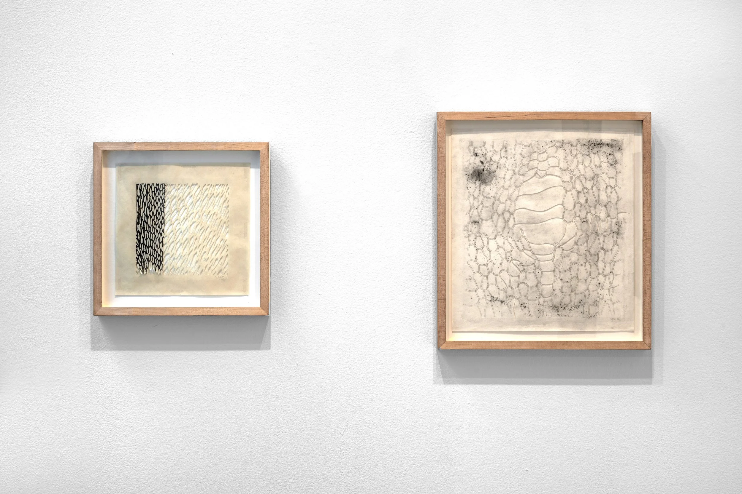 From the left: Safety Net, 2006, graphite on cut japanese rice paper, 11" x 11"; Undone, 2006	graphite on cut japanese rice paper,	21" h x 19"