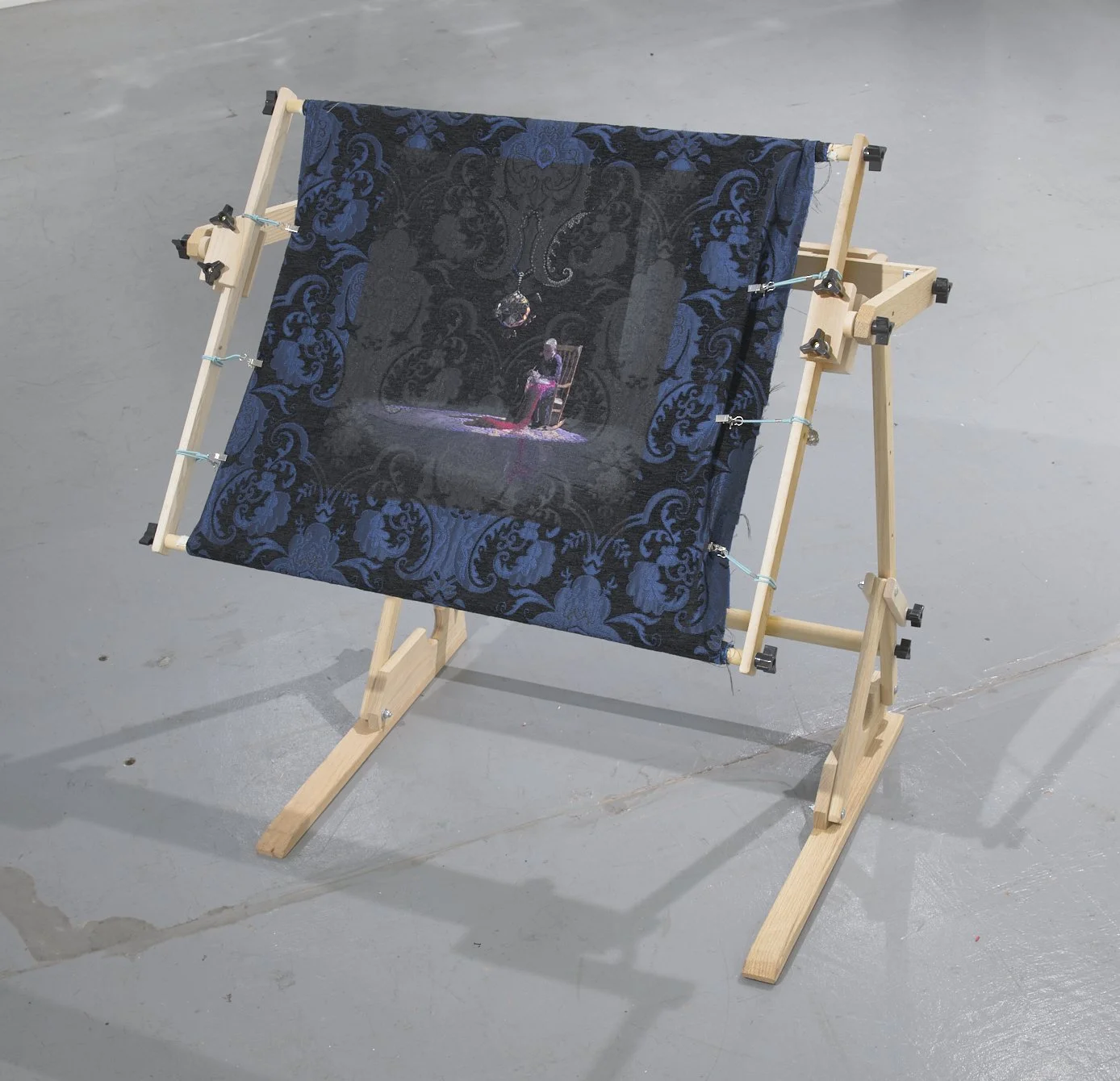 Needles or Knives? (2026) embroidery on photograph on brocade fabric on embroidery stand, 26.5" x 33" (embroidery stand dimensions variable)