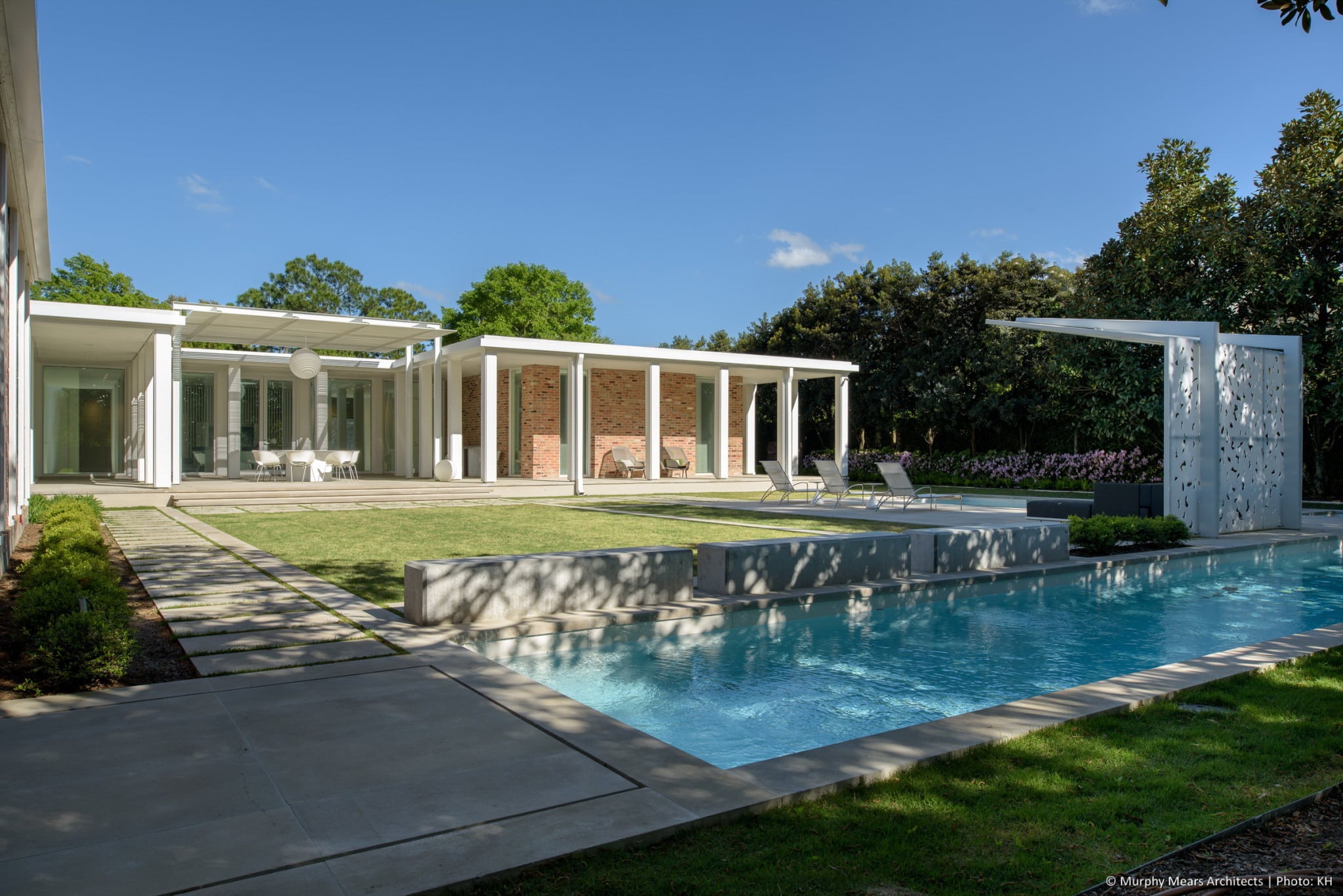 w-mid-century-modern-home-neuhaus-harwood-taylor-renovation-back-yard-trellis-lap-pool.jpg