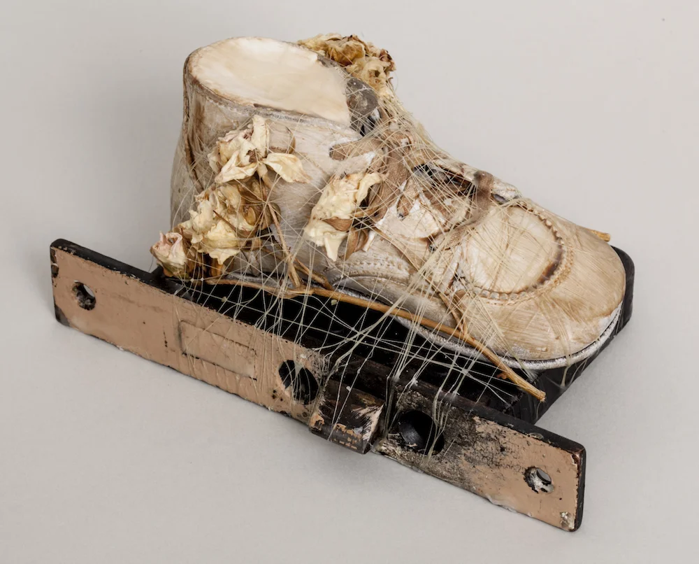 Baby Shoe with Dried Flowers and Mortise Lock, 2014, mixed media sculpture with encaustic, 3.5 x 4.25 x 7 inches