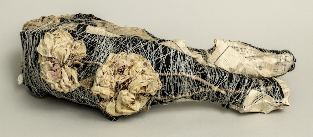 Black Bra with Dried Roses and Dress Patterns, 2014, mixed media sculpture, 4.25 x 4.75 x 14 inches