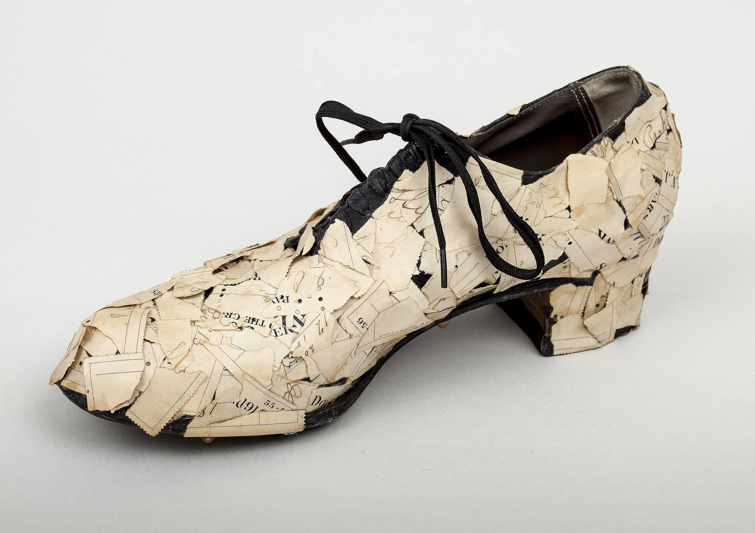 Lady’s Shoe with Torn Checks, 1982, mixed media sculpture, 4.5 x 10.5 x 3.5 inches