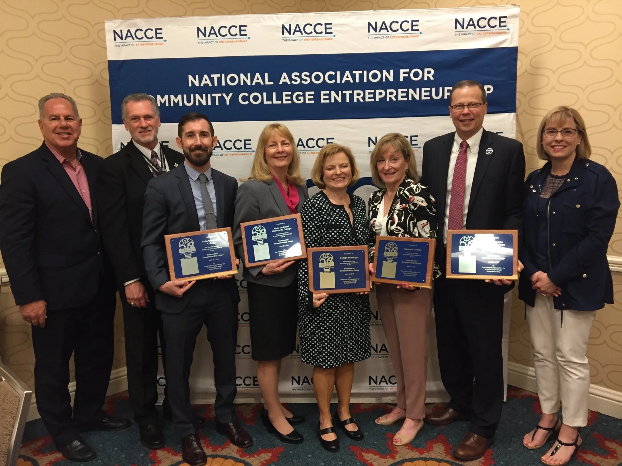 ACC President Richard Rhodes (second from left) and ACC Bioscience Incubator Director Tyler Drake (third from left) are shown. Image by Austin Community College