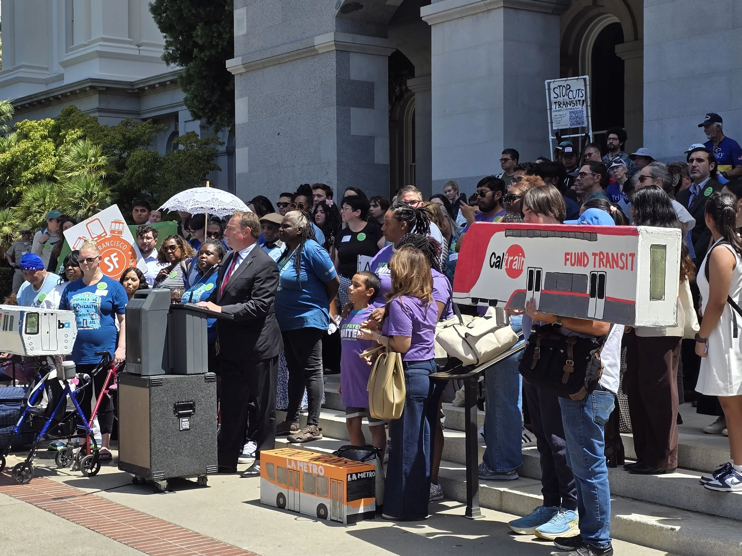 Hundreds rally at Sacramento State Capitol to protect billions in transit, housing, and climate funding currently in jeopardy