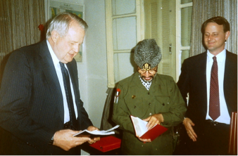  Chairman Arafat looking at the Bible we gave him   