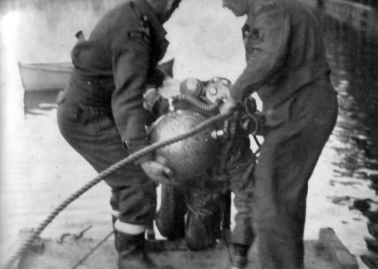 Lt George Gosse GC RANVR in Mine Recovery Suit after defuzing GD 'Oyster' pressure mine at Bremen 7 May 1945