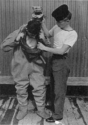 'P' Party trainee being dressed in Shallow Water Diving Suit 1 med.jpg