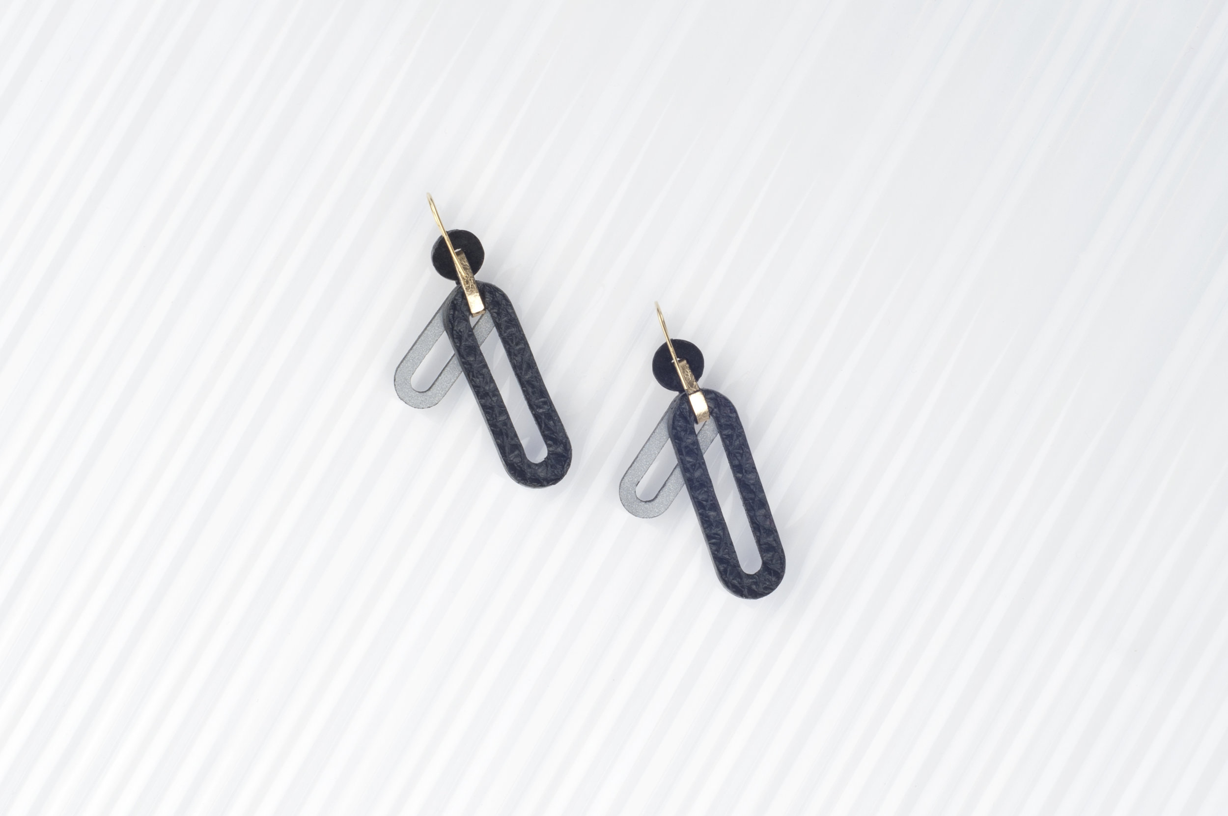 leather earrings with reflective details | Charlie